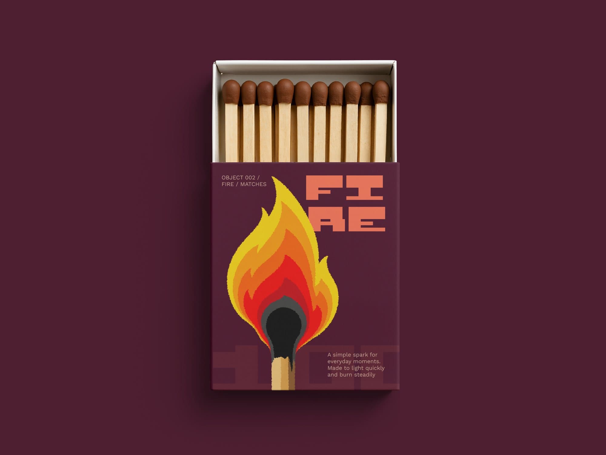 Open matchbox on maroon: FIRE split over two lines in coral Riteblock above an illustrated burning match.